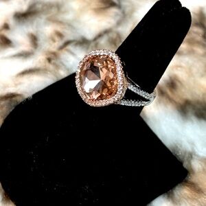 Rose gold and silver cocktail ring with rhinestone accents. Size 6.
